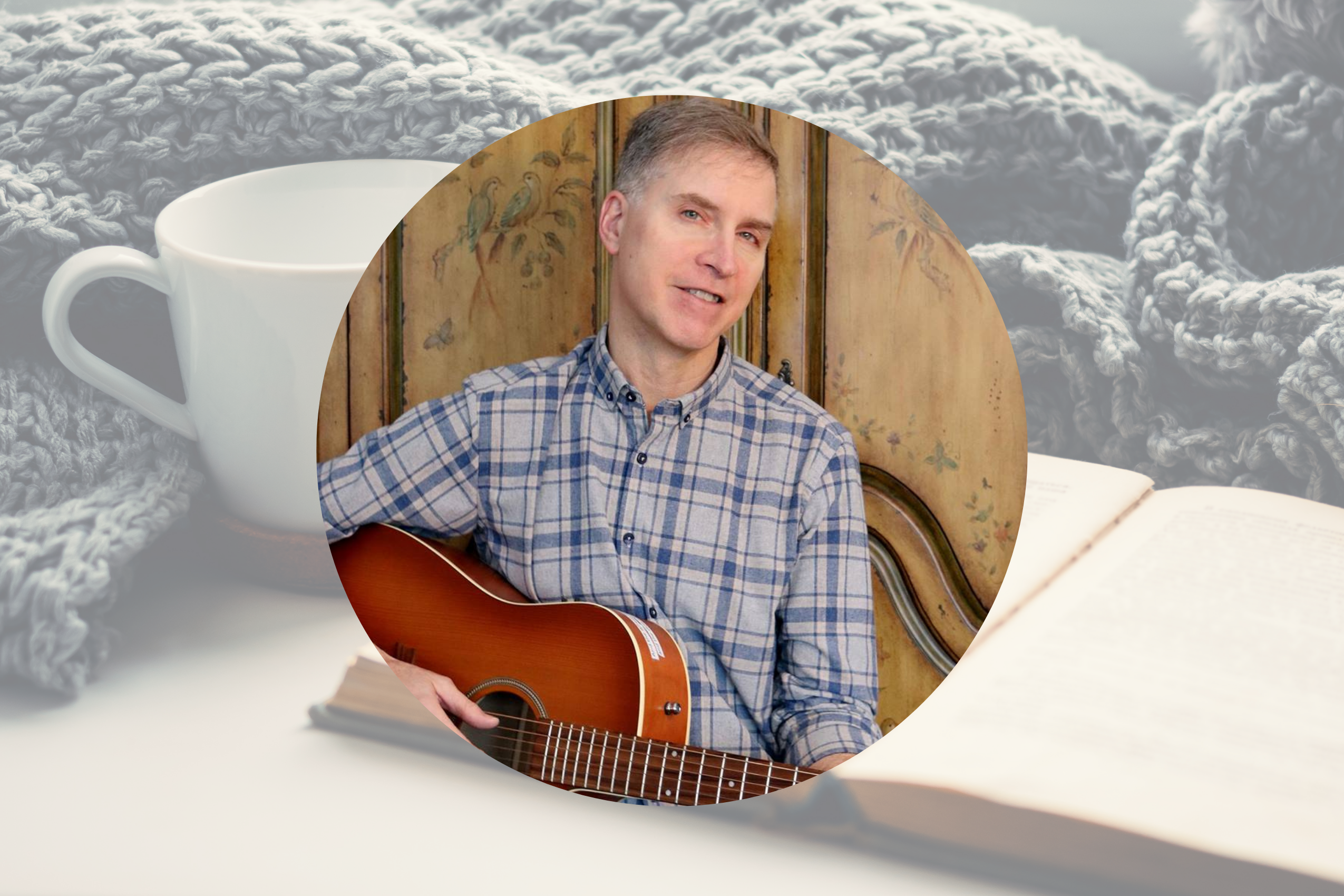 drew velting playing guitar with book, cup and blanket in background