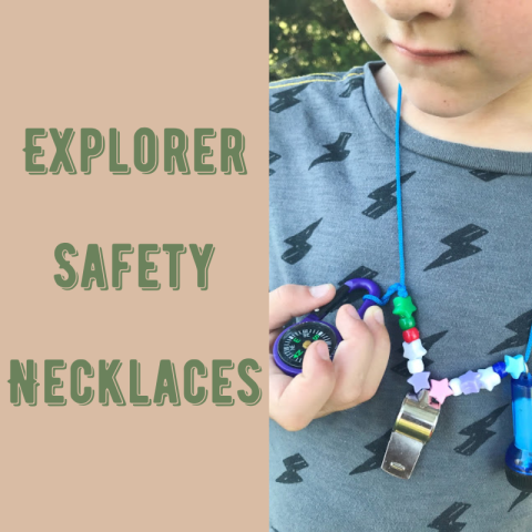 An explorer safety necklace around the neck of a child.